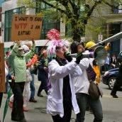 Temma Frecker and Claudine Furnion blow their horns on Spring Garden Road during the rally.