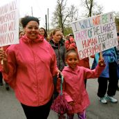 Tawnya and Nadia Barington hold up their signs in solidarity with the demand to have GMOs labelled. 