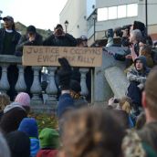 Many of those arrested yesterday watched the protest from the perimeter of Parade Square.  A condition of their release was not stepping foot in Parade Square or any public park. Photo: Lesley Thompson