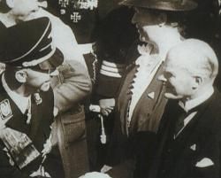 Gustav Krupp greets Reichsführer SS Heinrich Himmler at the launch of Navy cruiser Prinz Eugen from the Krupp Germania Werft yard at Kiel. Krupp was convicted of crimes against humanity by the Nuremberg Tribunal. His sentence was commuted by the USA.