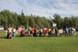 Gathered crowd at Rogersville cemetery. [Photo: M. Howe]