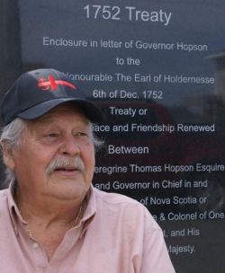 Chief Reg Maloney in front of monument commemorating the Treaty of 1852